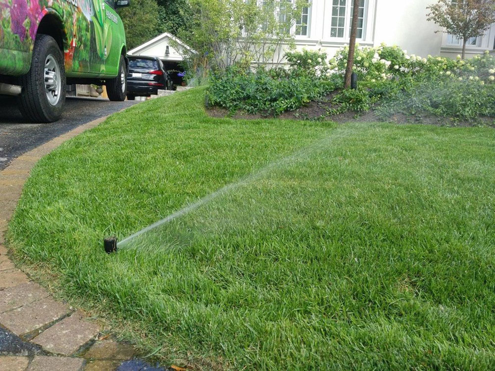 Traditional-Home-with-Sprinkler-System-and-Landscape-by-Pro-Green-Irrigation Looking for the best lawn sprinkler?  Here are your best options