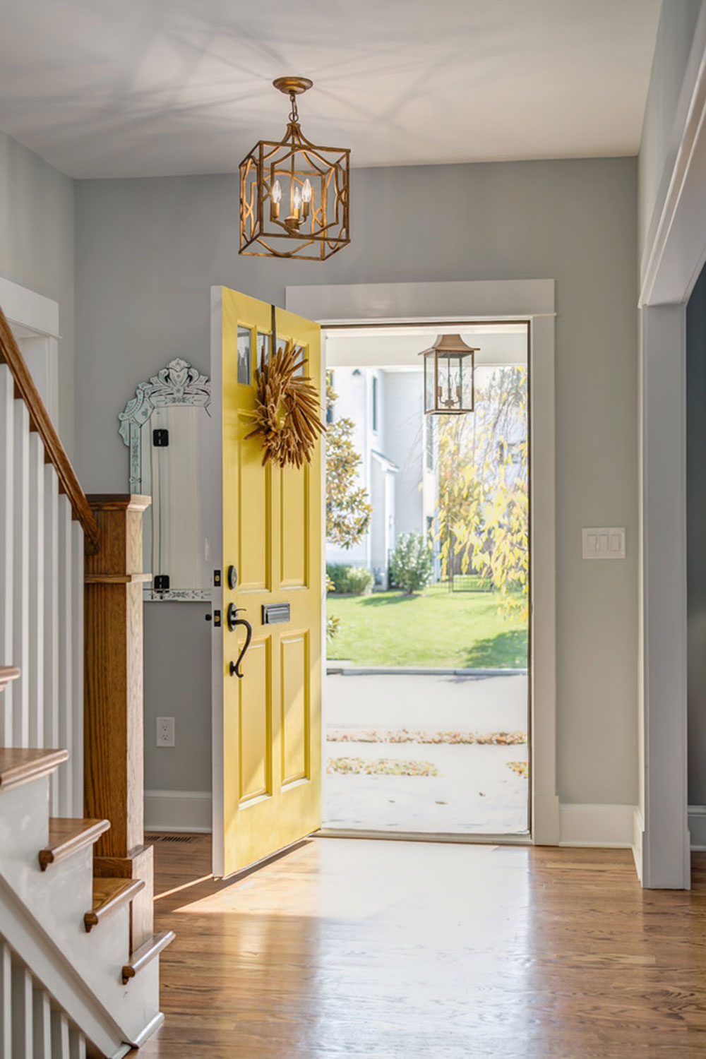 Cape-Cod-Charm-by-Moser-Architects-PLLC Yellow front door ideas for a vivid house entrance