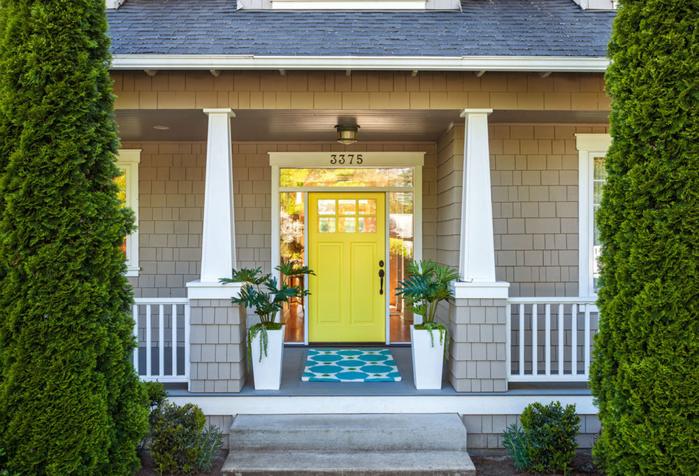 Craftsman-Cottage-Entry-by-Garrison-Hullinger-Interior-Design-Inc Yellow front door ideas for a vivid house entrance