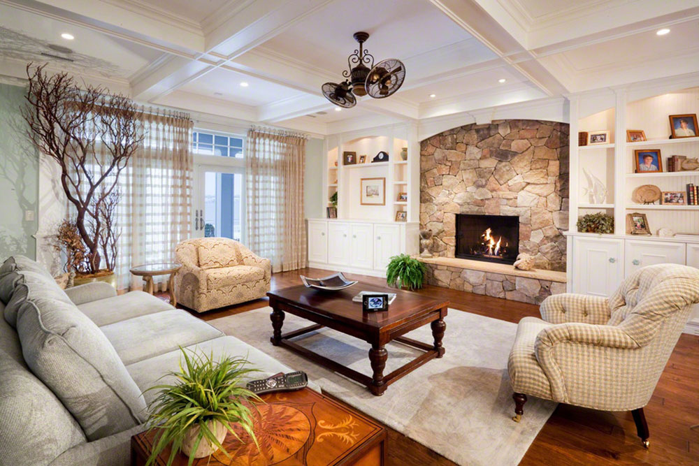White-Room-with-Stone-Fireplace-by-Electronics-Design-Group-Inc Stone Fireplace Ideas. How to Decorate a Stone Fireplace.