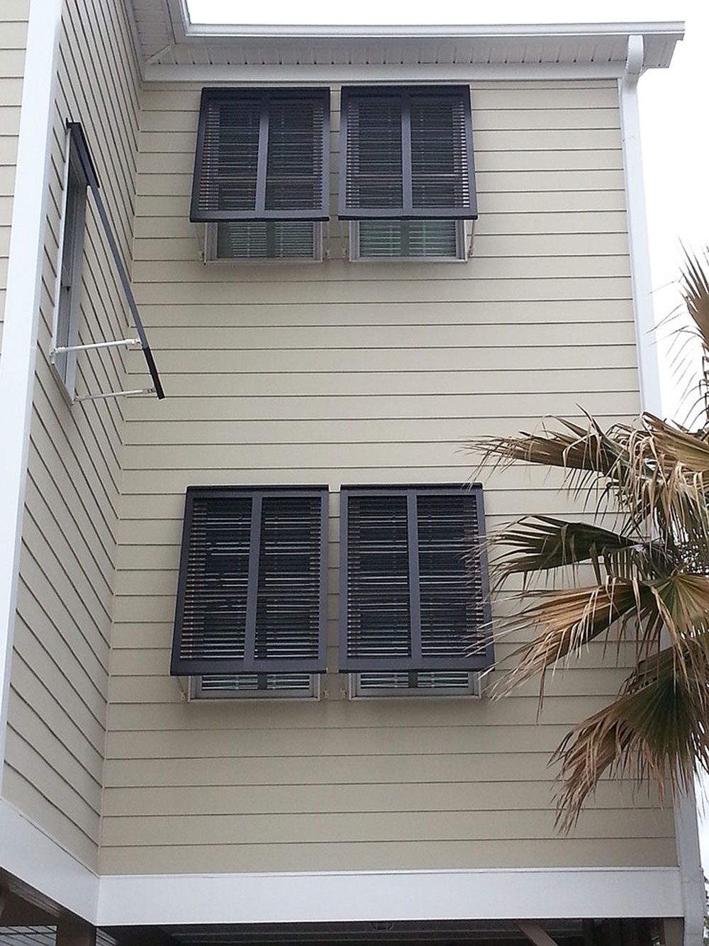 Bermuda-Shutters-by-The-Plantation-Shutter-Company What are Bahama shutters & what are their pros and cons