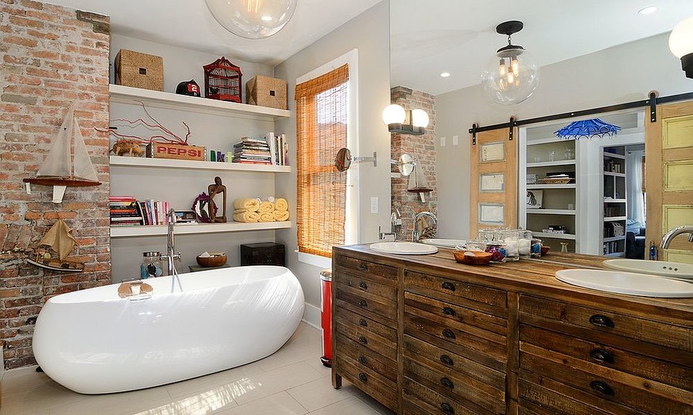 Modern-eclectic-bathroom-with-exposed-brick-wall-rustic-wooden-vanity-and-ample-shelf-space-1000x600 Modern bathroom door ideas to try in your house in the near future