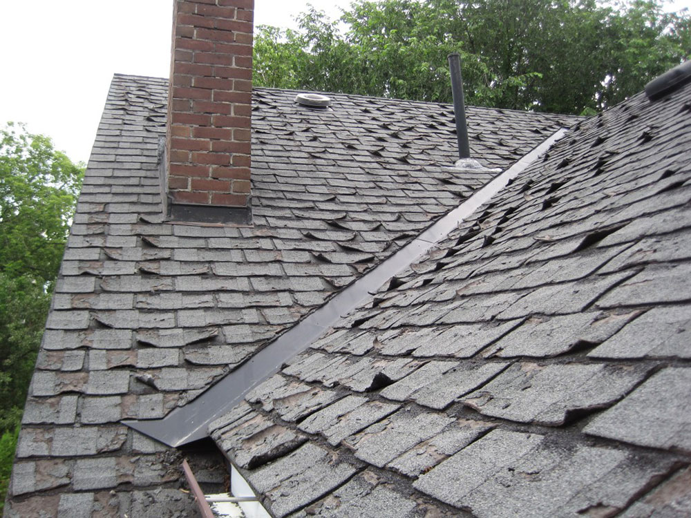 Shingles-curling-and-buckling How long do asphalt shingles last and when you should change them