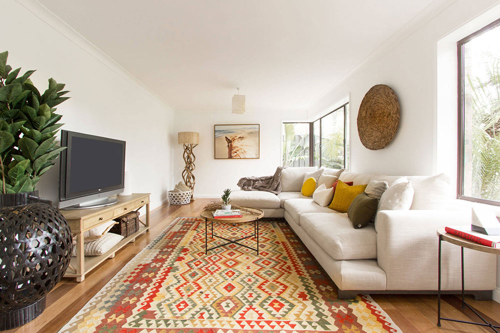 Tribal-Escape-by-Advantage-Interior-Design What's the best living room rug placement? (Answered)