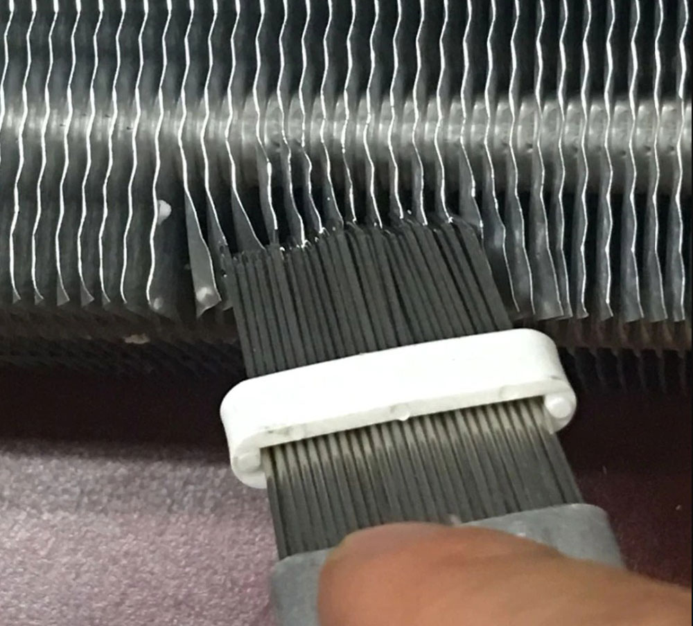 Comb-the-aluminum-fins How to Clean a Window Air Conditioner Without Removing It (Answered)