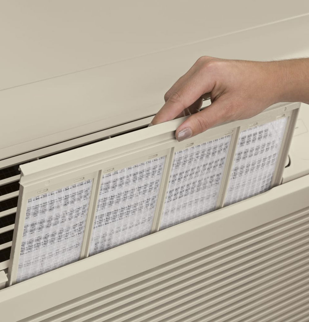 Let-the-filter-dry-then-put-it-back-in-place How to Clean a Window Air Conditioner Without Removing It (Answered)