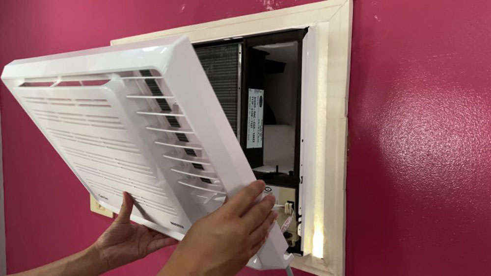 Remove-the-units-front-panel How to Clean a Window Air Conditioner Without Removing It (Answered)