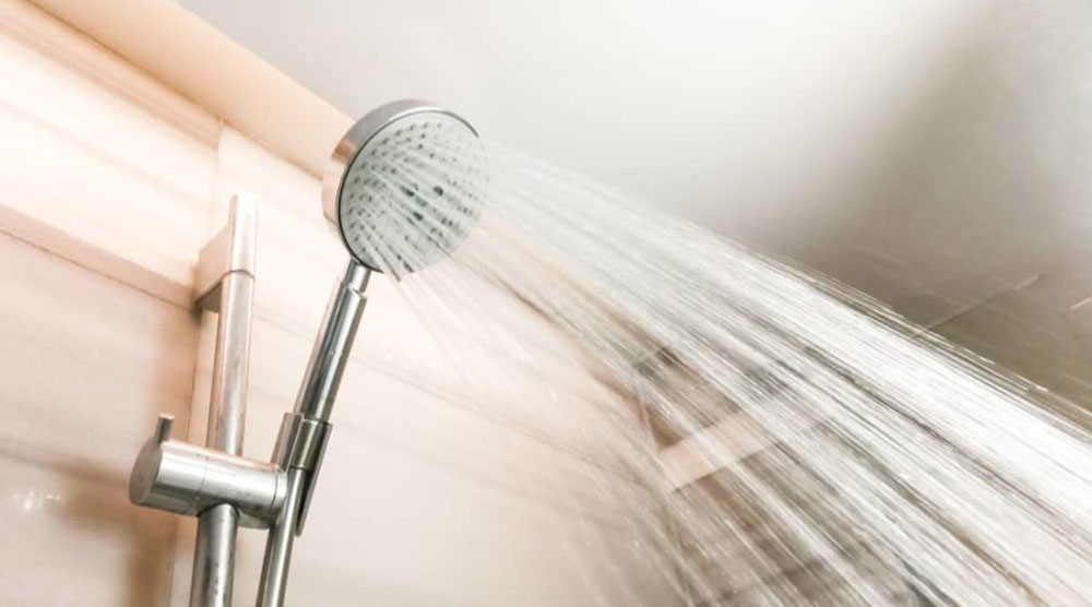 low-pressure-showerhead What Causes Low Water Pressure in the Shower and How to Fix It (Answered)