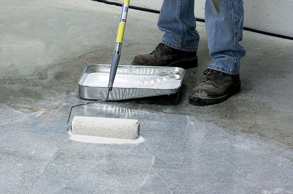 Apply-a-bonding-agent-to-the-concrete How to level a concrete floor that slopes (Must read)