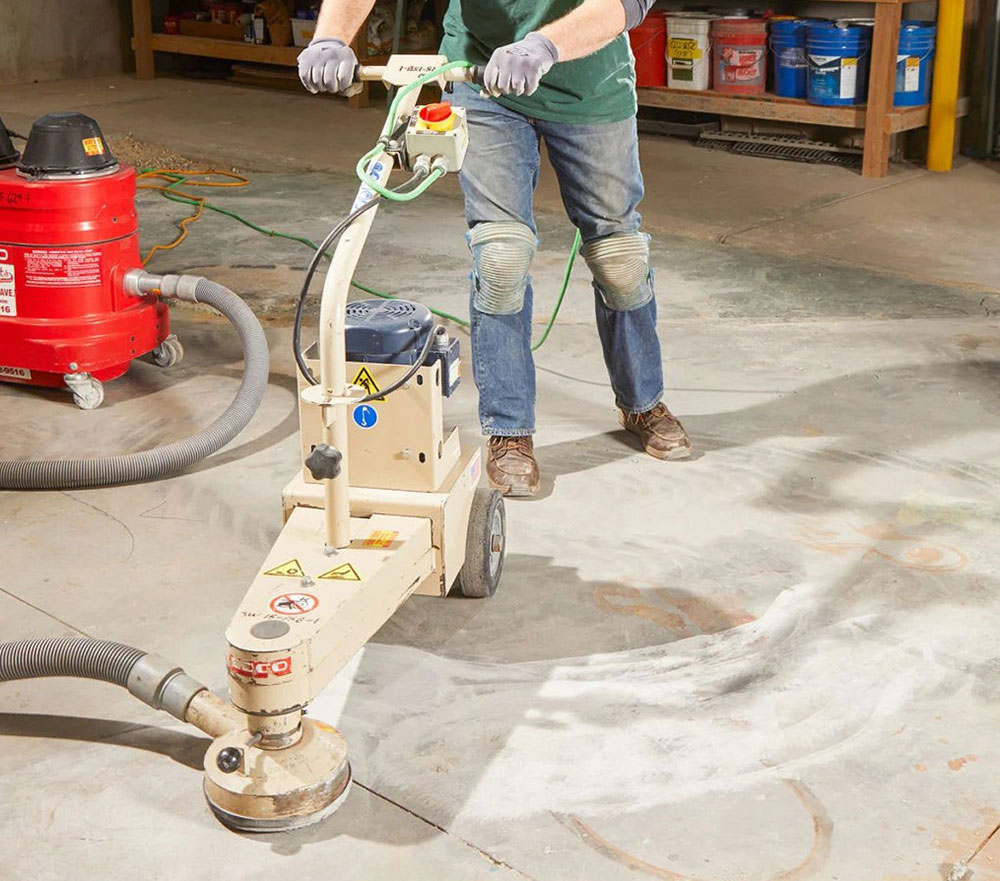 Grind-down-the-uneven-high-points How to level a concrete floor that slopes (Must read)