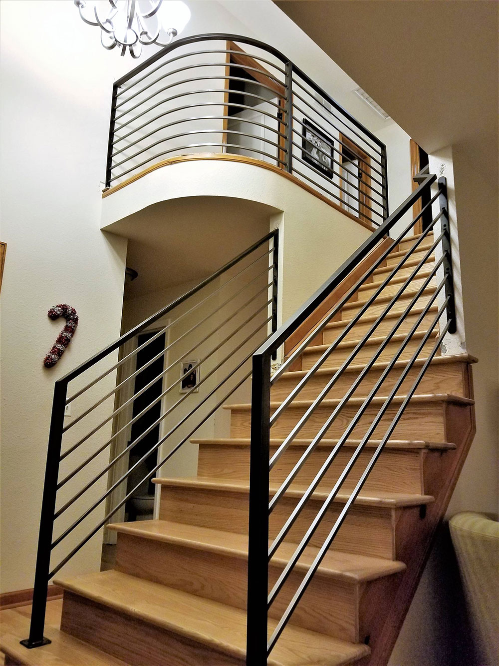 Contemporary-Railing-with-Curve-by-Rod-and-Forge How to make an unfinished basement look finished easily