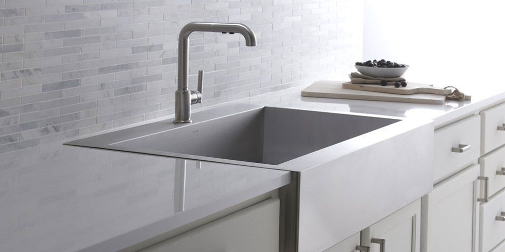 Stainless-Steel-Farmhouse-Sink The Most Elegant Sink Design Ideas for Contemporary Kitchens