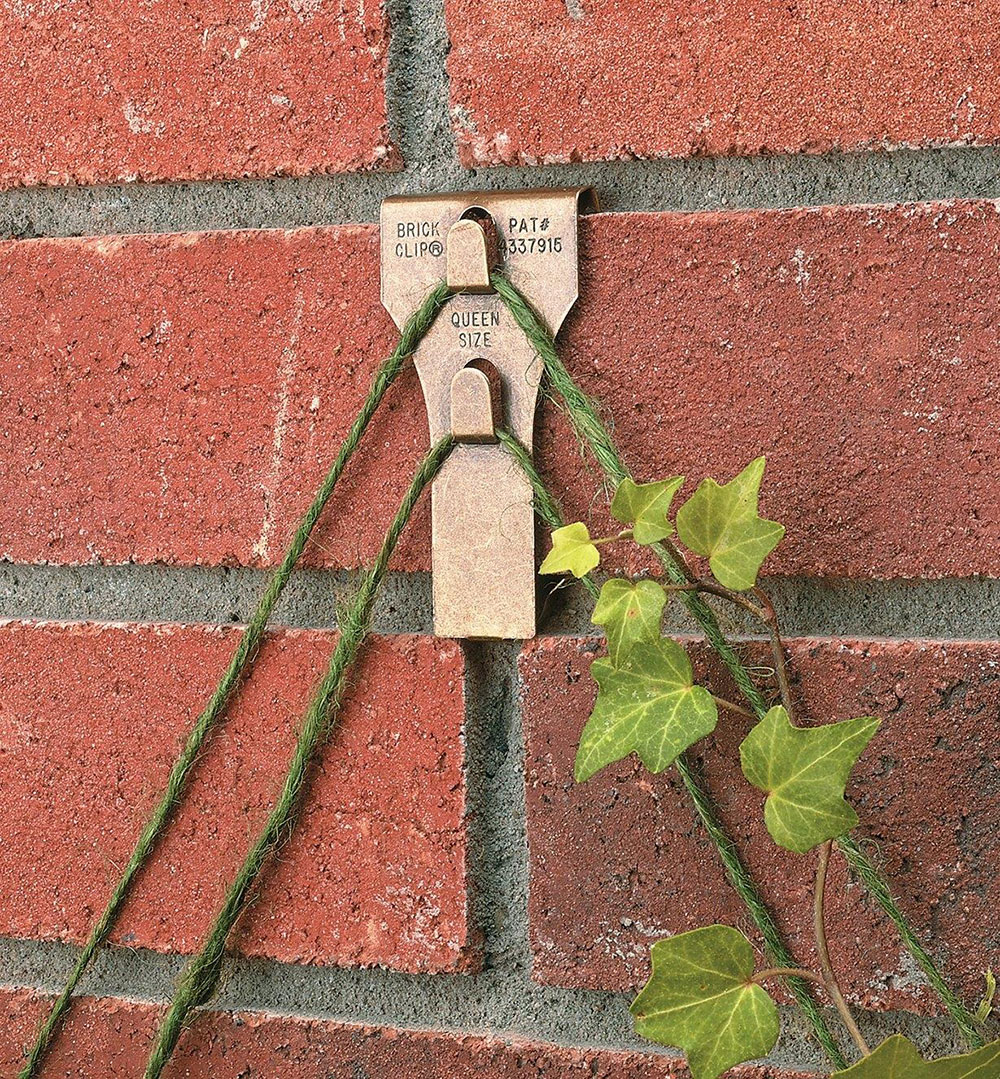 Brick-Clamps How to hang pictures on brick without making mistakes