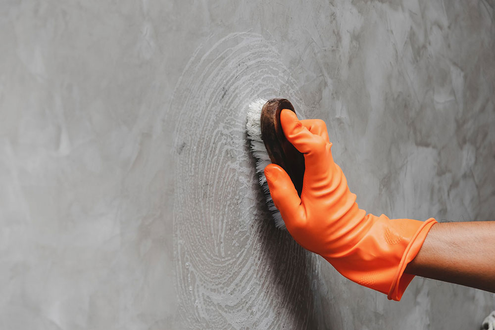 Give-the-concrete-surface-a-deep-cleaning-and-allow-it-to-dry. How to remove paint from concrete walls