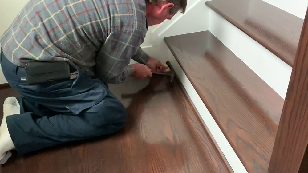 Screw-down-loose-threads How to fix creaky stairs in a few easy steps