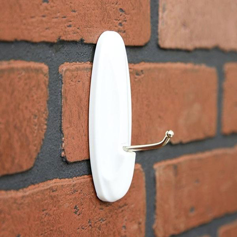 Use-pinch-hangers How to hang pictures on brick without making mistakes