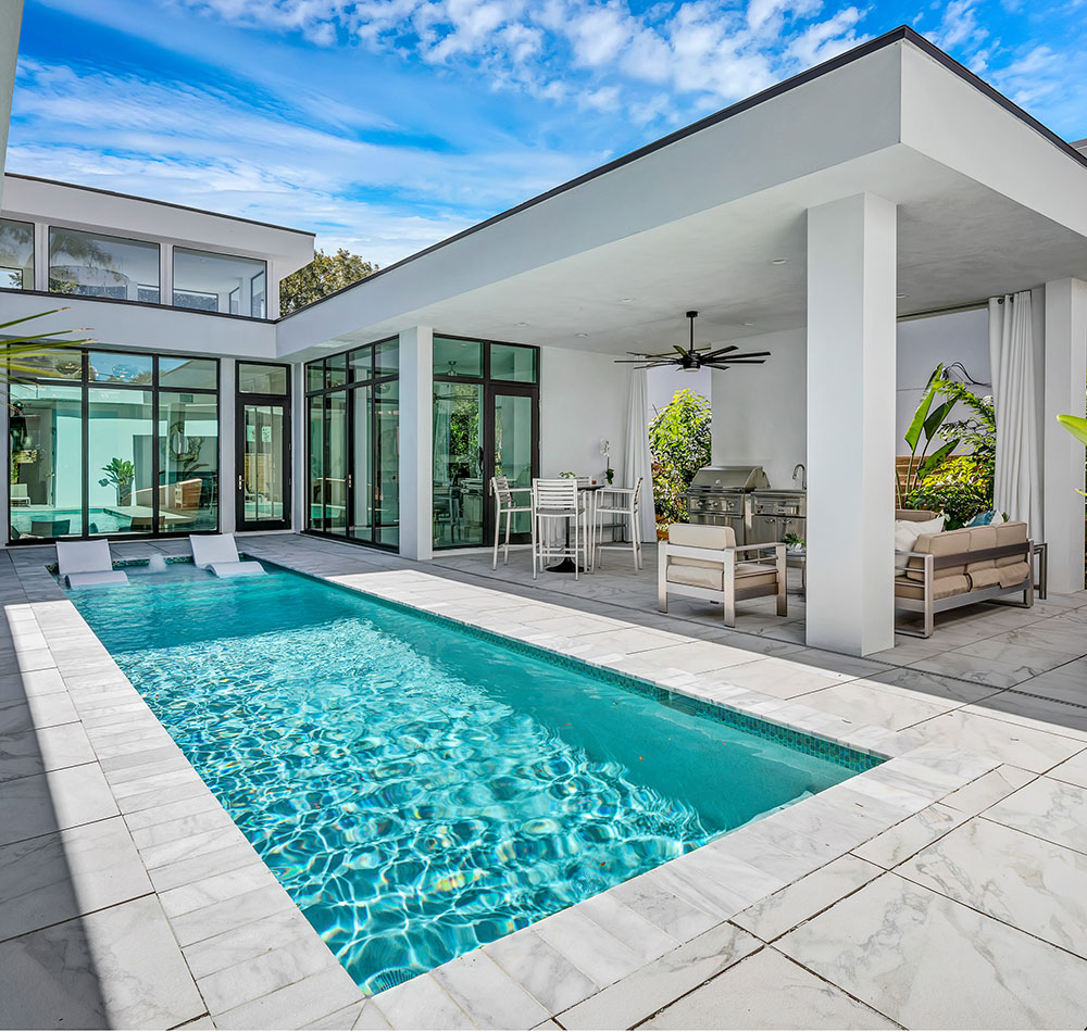 MID-CENTURY-MODERN-TAMPA-FL-by-Debra-Ackerbloom-Interiors-LLC What is a good size swimming pool for a home