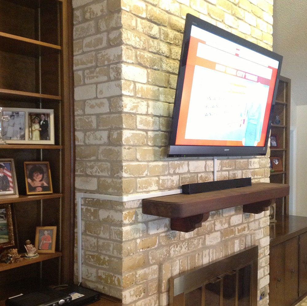 Tv Wires Over A Brick Fireplace, How To Mount Tv Into Brick Fireplace