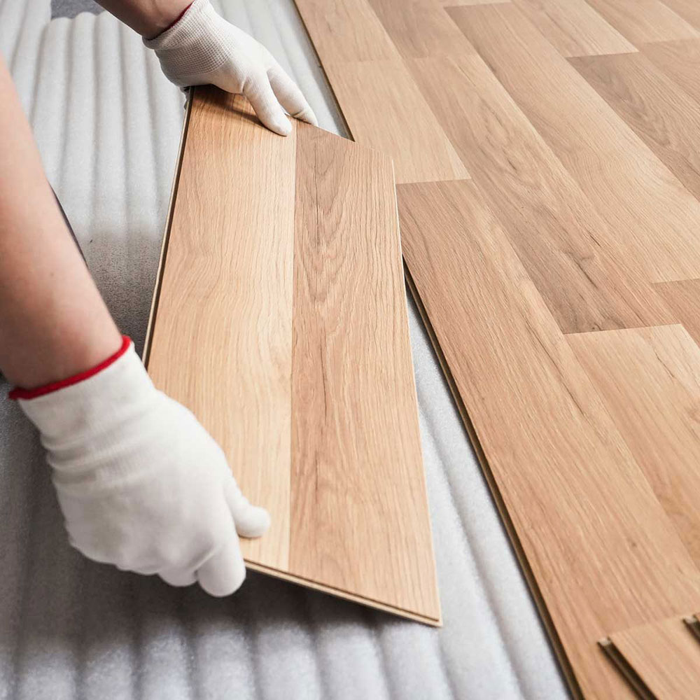 Install-the-laminate-planks How to install laminate flooring on a concrete basement floor