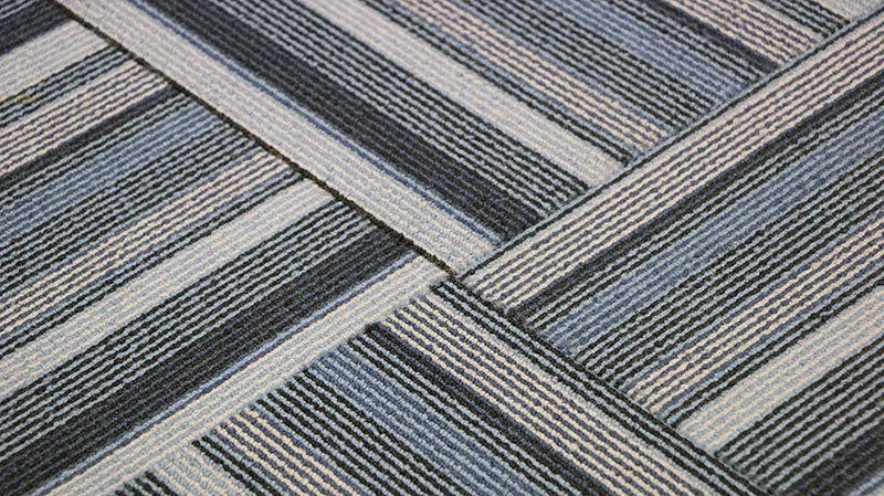 AdobeStock_288122909 6 Advantages Of Using Carpet Tiles Over Roll-On Carpets