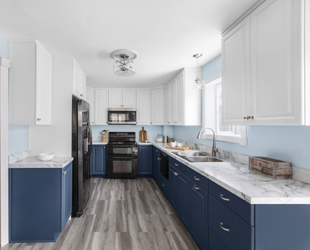 Blue-White-Cabinets-with-Grey-Details-by-Kitchen-Magic How To Paint Pressed Wood Kitchen Cabinets