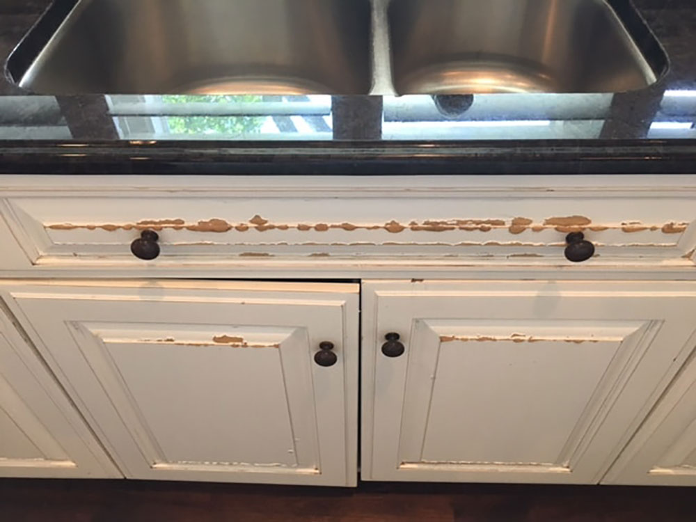 damaged-cabient How to get a smooth finish when painting kitchen cabinets